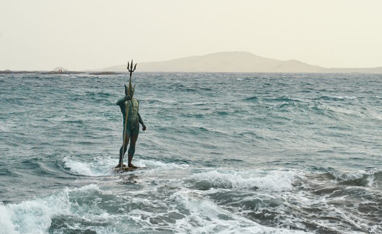 Statue of Greek God Neptune at Melenara Beach on Gran Canaria Island